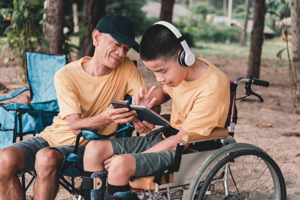 Father take care for disabled child in wheelchairs with love