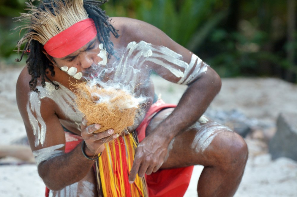 man holding a coconut skin